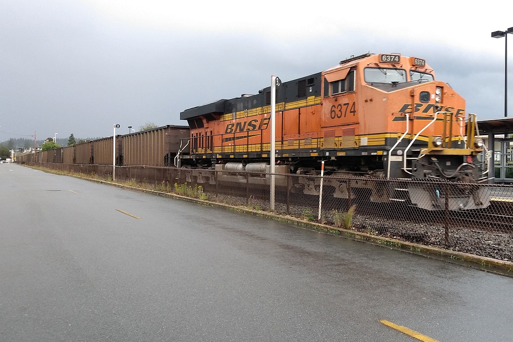 BNSF 6374 pushing a NB coal train toward Canada